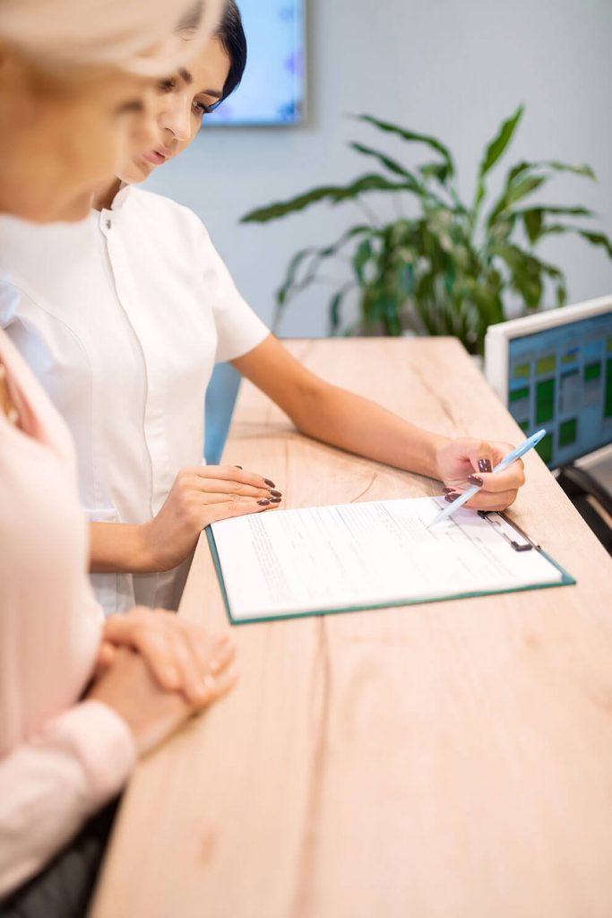 Patient filling out eye examination forms