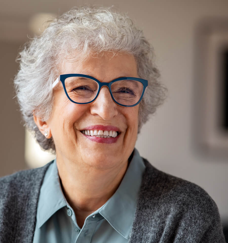 A happy woman with glasses who can see clearly