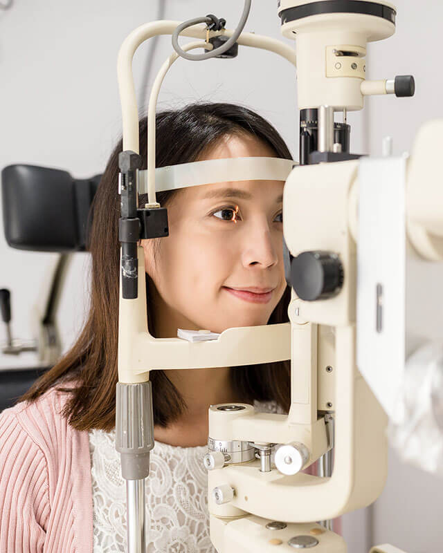 A woman getting her eyes examined to check eye health 
