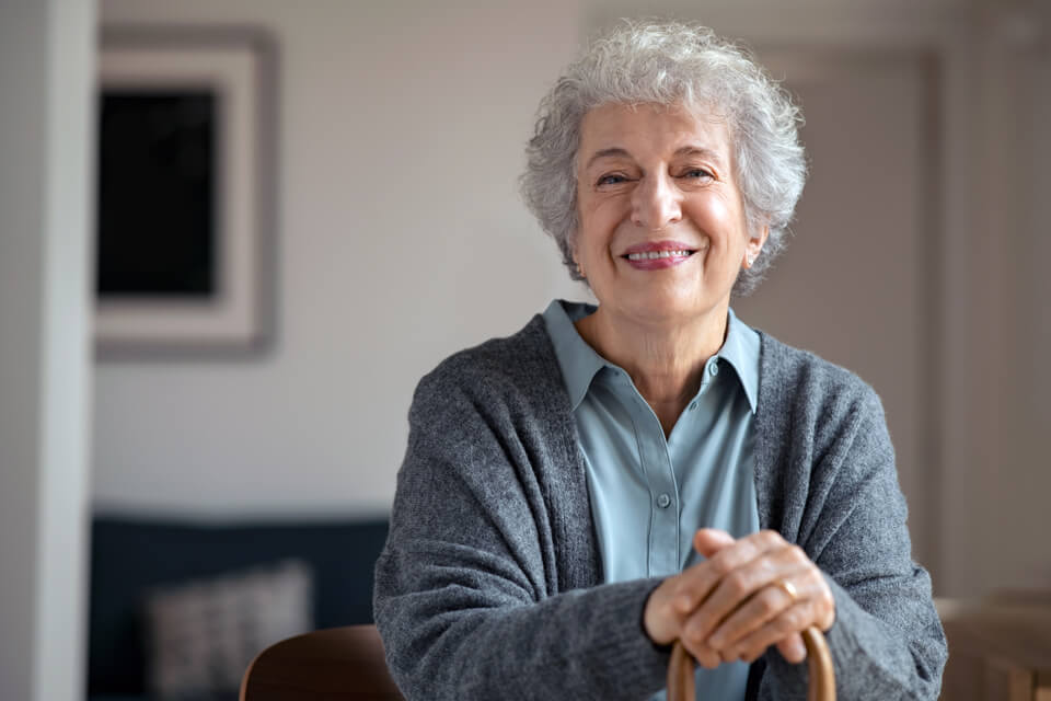 elderly woman waiting at eye doctor office