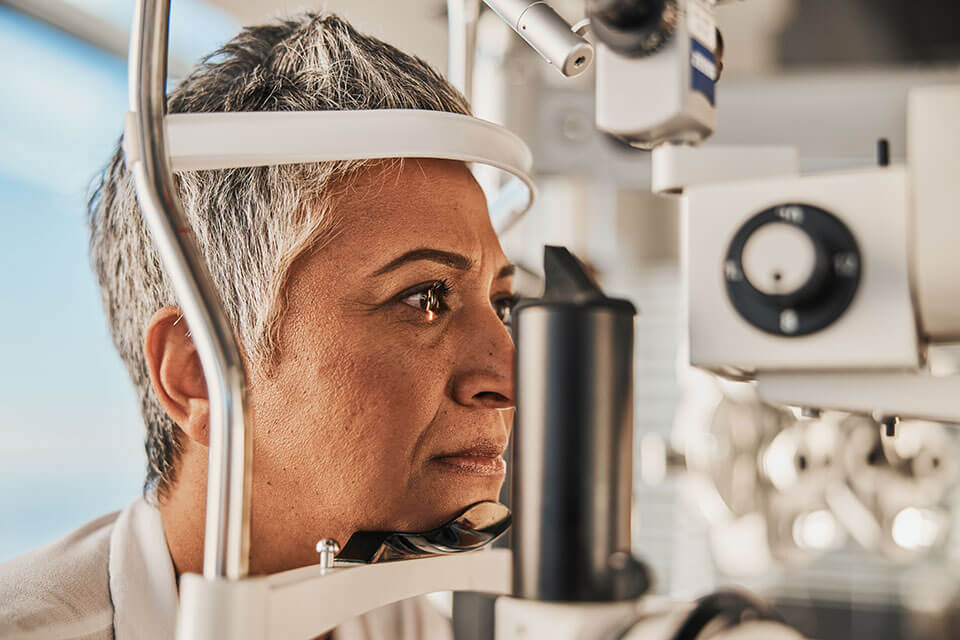 Retina Eye Clinic in Opelousas examines a woman's eye with light