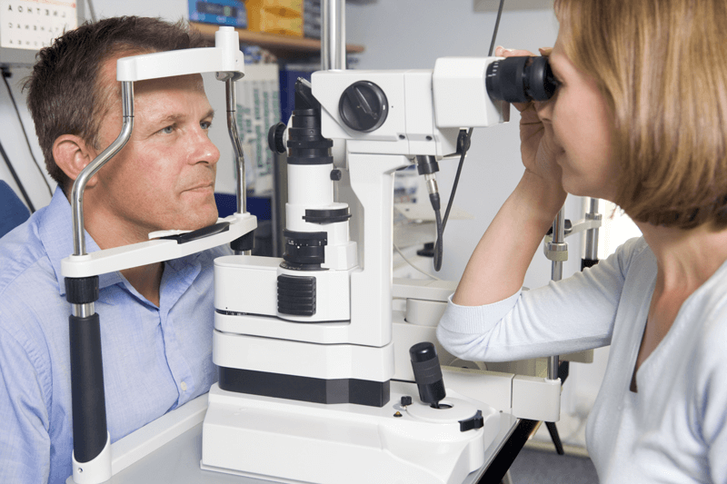 Eye doctor for macular degeneration in Baton Rouge examining patient