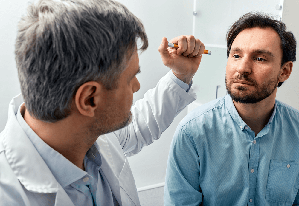 Eye doctor examining patient for geographic atrophy treatment in Baton Rouge