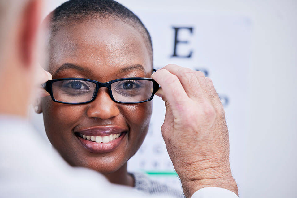 woman happy with retina eye clinic covington glasses