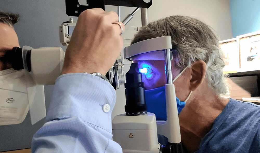 Elderly patient getting retinal diagnostic testing in Baton Rouge